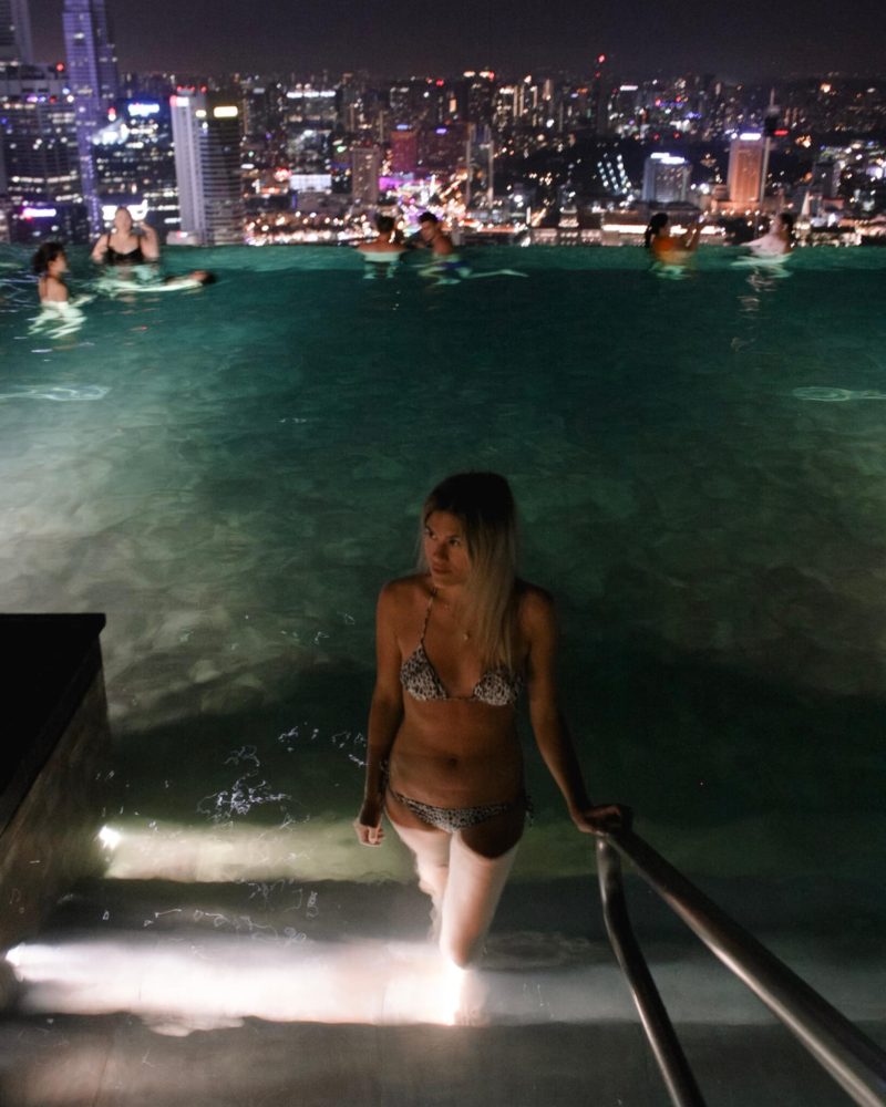 Christina coming up the stairs in the infinity pool at marina bay sands